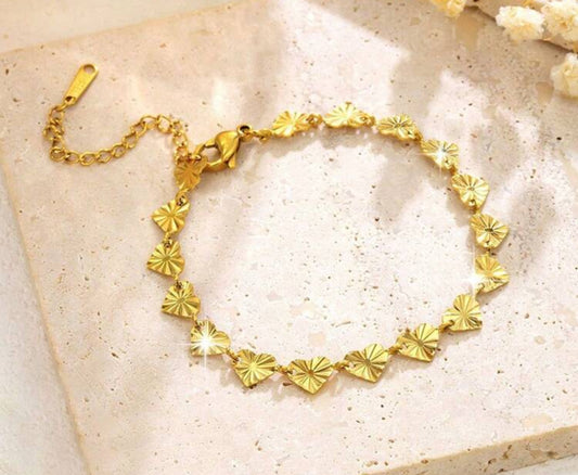 Bracelet doré et cœur