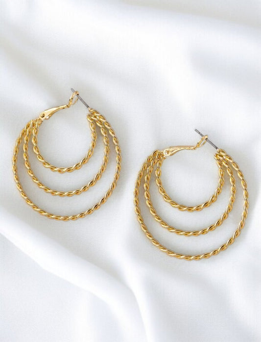 Boucles d'oreilles créoles tressées triple dorées