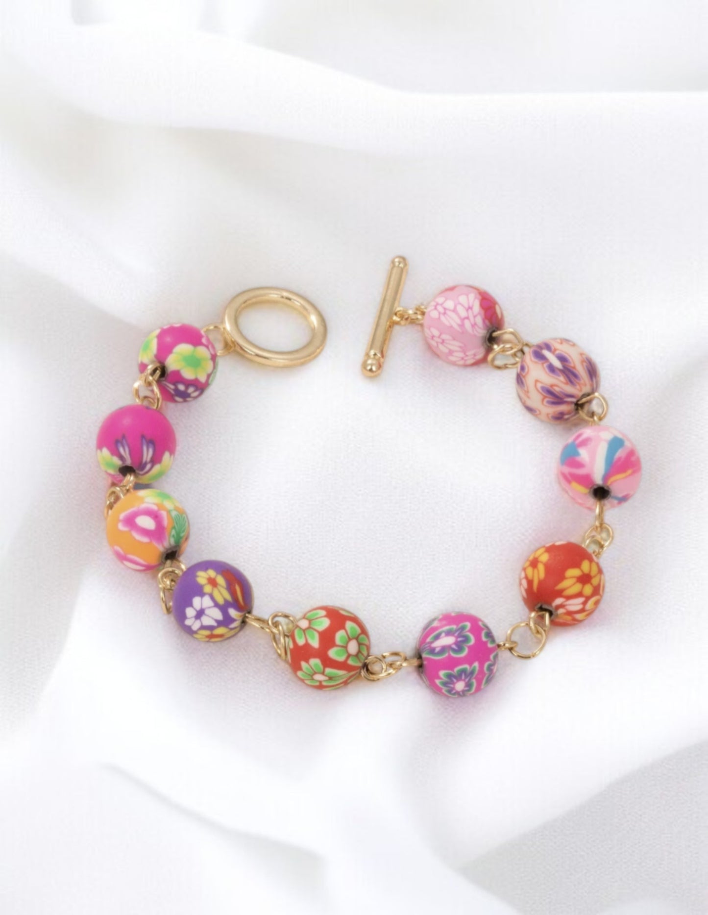 Bracelet breloques motif floral multicolores doré