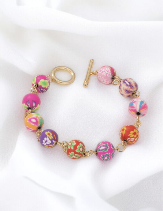 Bracelet breloques motif floral multicolores doré