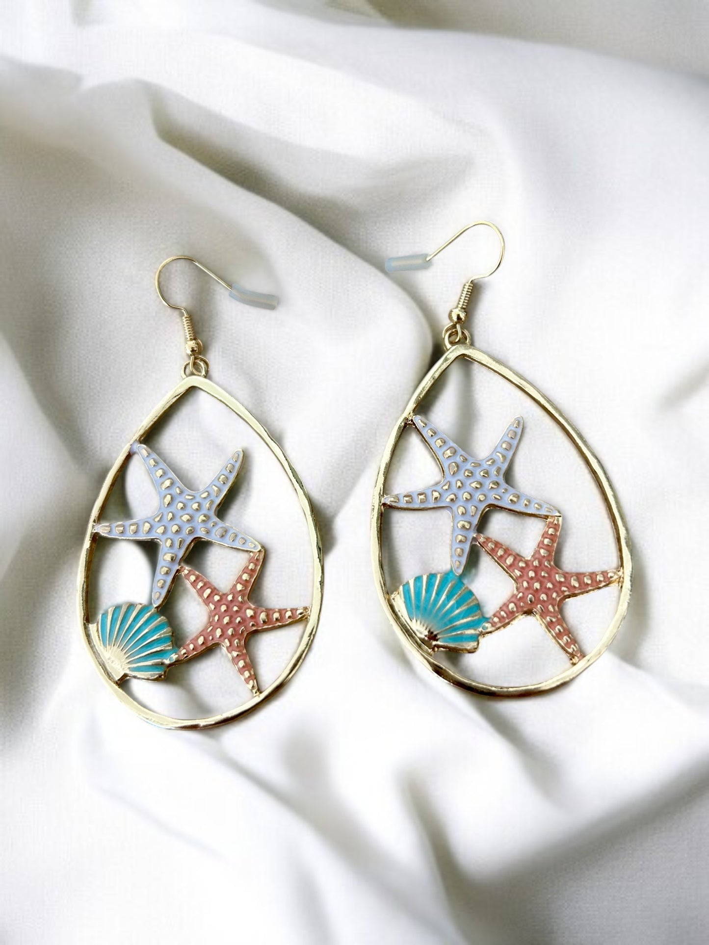 Boucles d'oreilles créoles dorées motif coquillage