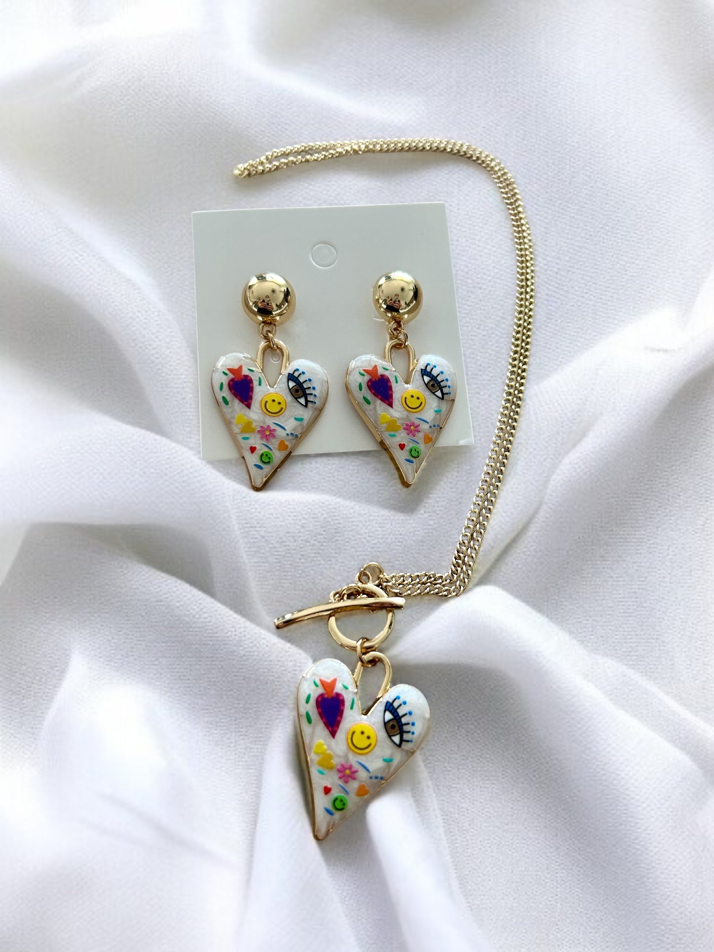 Parure 2 bijoux doré multicolores motif cœur et œil